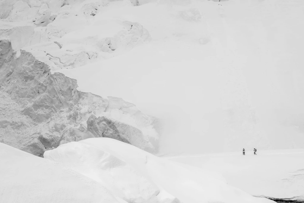 A black-and-white photograph of a mountain landscape by Jahow Yu.